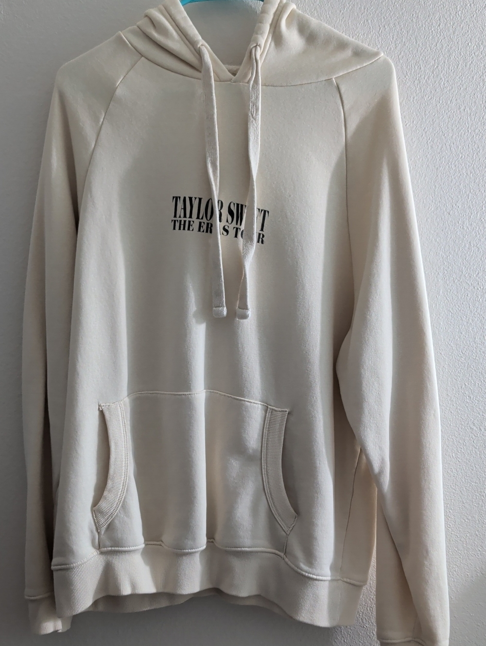 Taylor Swift Cream Hoodie with Black Chest Logo